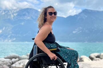 Carrie-Ann Lightley poses for a picture in front of a lake in Italy