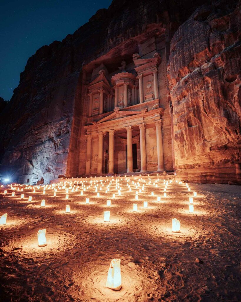 Petra in Jordan is lit up by candles at night. A membership to Club Avandra, which takes female travellers here, belongs on any experiential gift guide