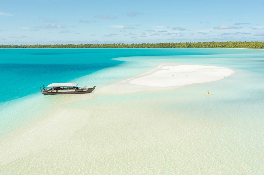 A boat in the blue lagoon of Aitutaki in the Cook Islands