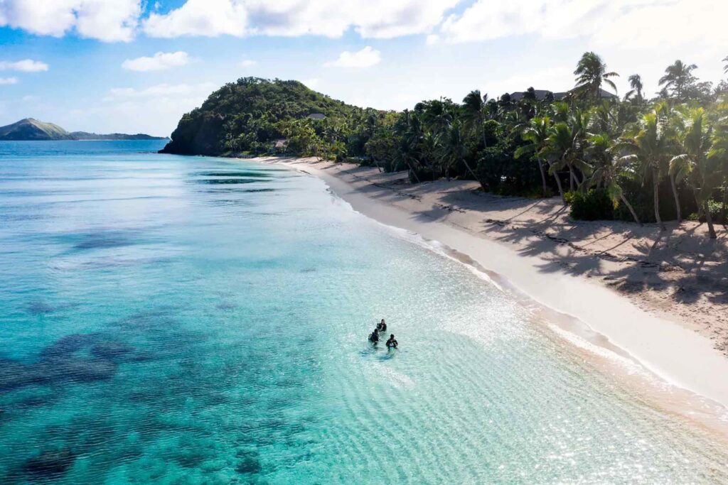 Divers offshore on Kokomo Private Island Fiji. An example of the kind of unscripted journeys we'll go on in 2025