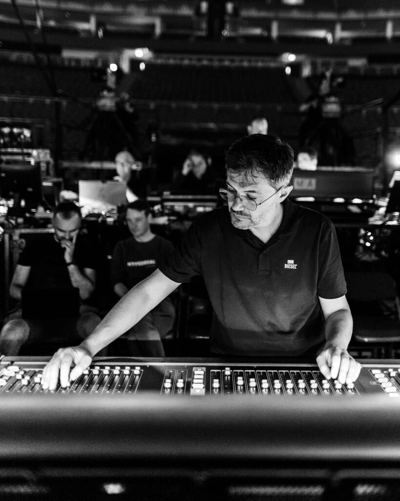 A staff member at The O2 in London, UK, working with a L-Acoustics sound system