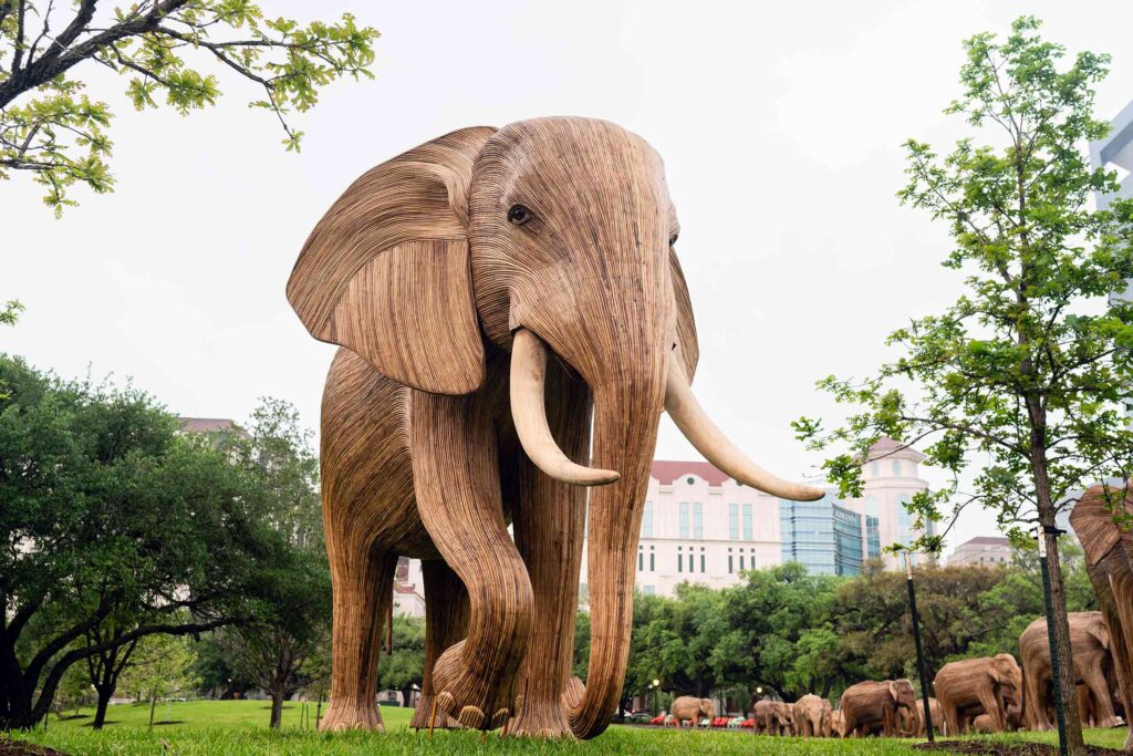 A wooden sculpture of an elephant in Houston, Texas, as part of a collaboration between LOVE BRAND Co. and The Great Elephant Migration