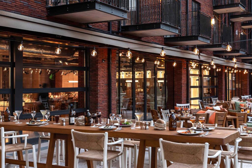 An outdoor restaurant area with fairy lights at Mob House.
