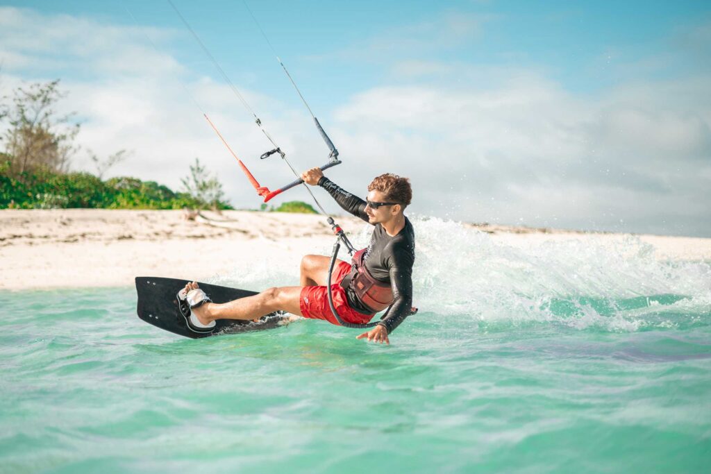 Man kitesurfing, new at Four Seasons Seychelles Desroches