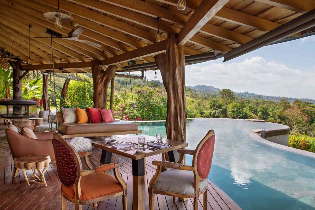 Poolside dining table at Origins Lodge, Alajuela, Costa Rica