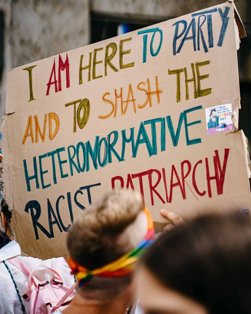 Placard saying I am here to party and to smash the heternormative racist patriacht for Pride Month