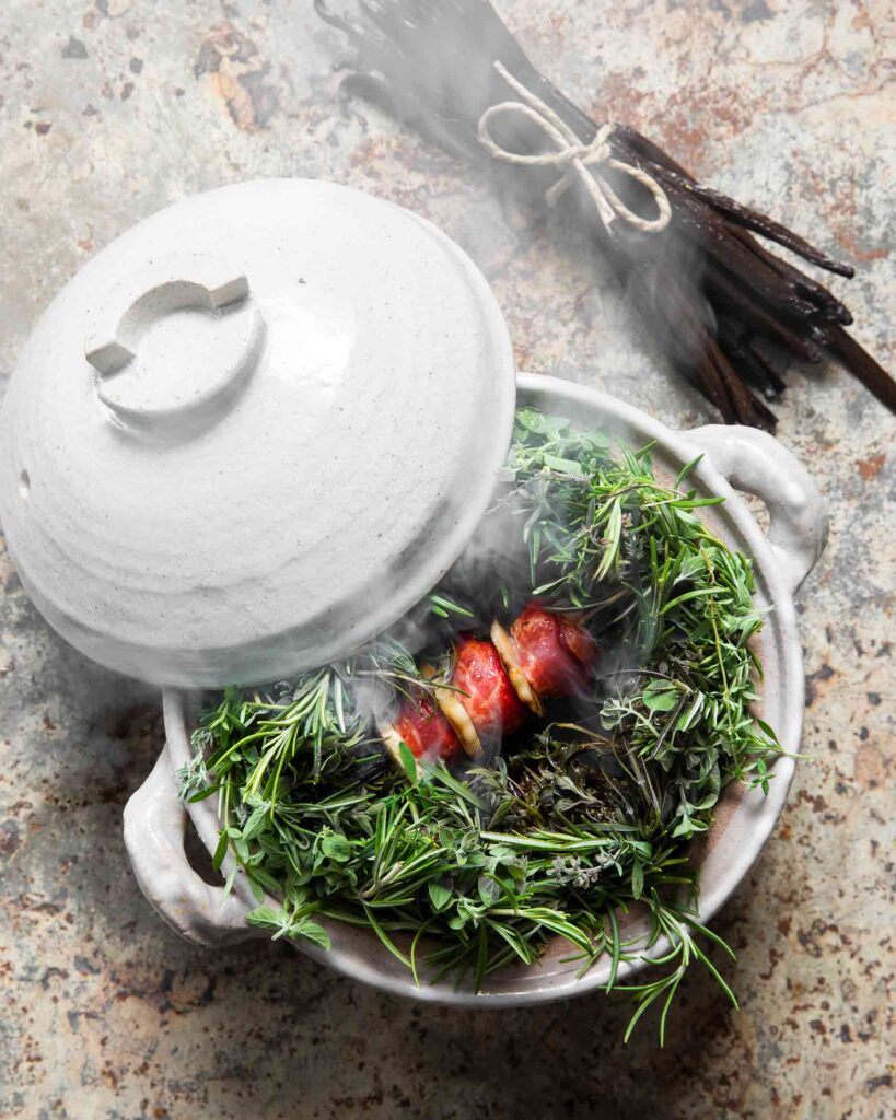 Food in a white earthenware pot prepared by Chef Mauro Colagreco