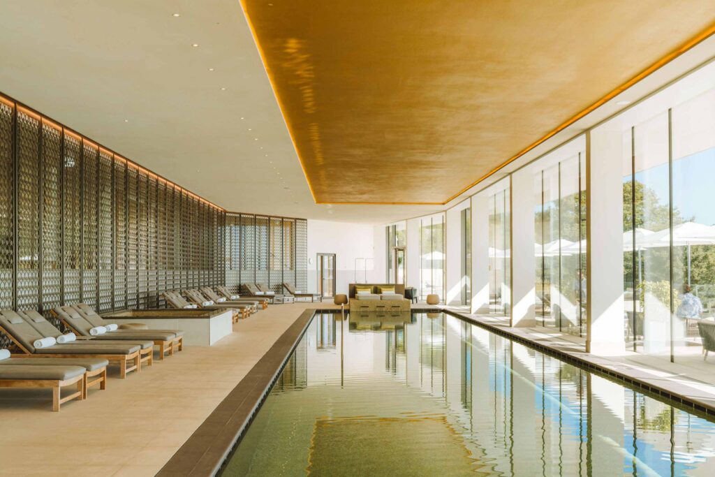 The indoor spa pool with panoramic windows at the Royal Champagne Hotel & Spa.