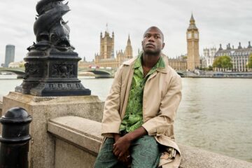 Folu Odimayo models contemporary British menswear in front of the Houses of Parliament in London, UK