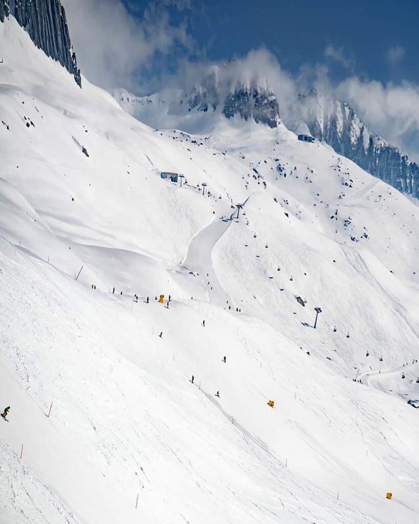 Skiers on a piste in Andermatt, Switzerland