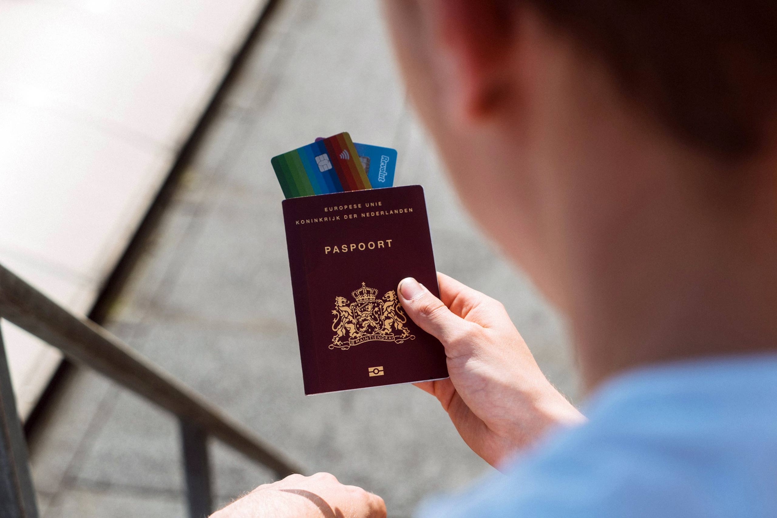 A man holds his passport in an airport. The Layover, Border control