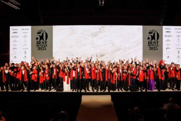 Hoteliers pose on stage at The Worlds 50 Best Hotels 2025