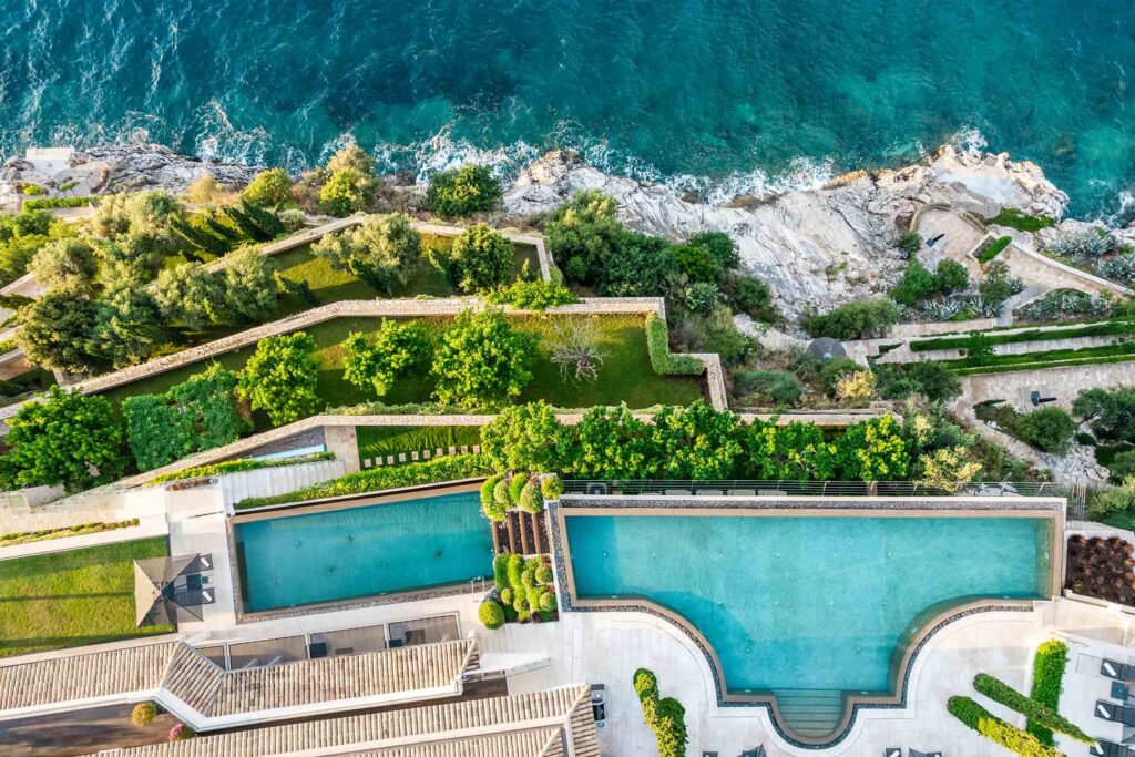 Overhead shot of a villa Paul against a rugged coastline