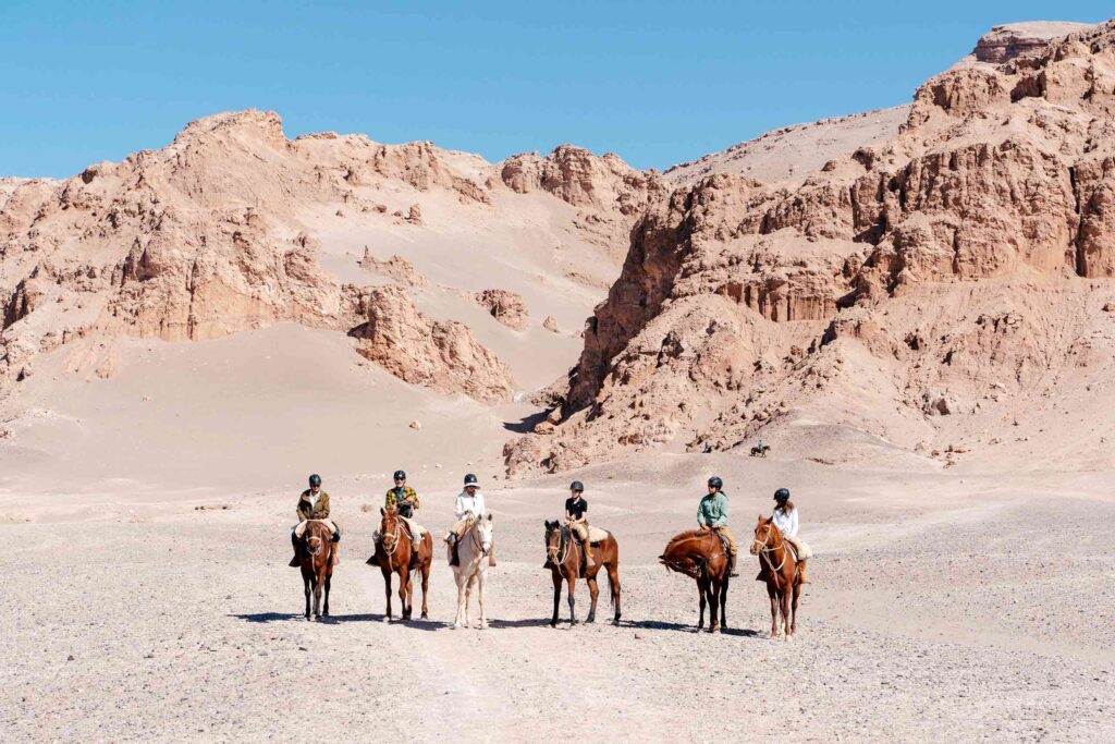 Visitors go horse-back riding during an adventure with White Desert Dr. Jones Collection